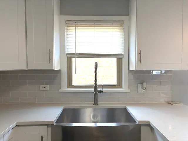 a kitchen with a sink and a window