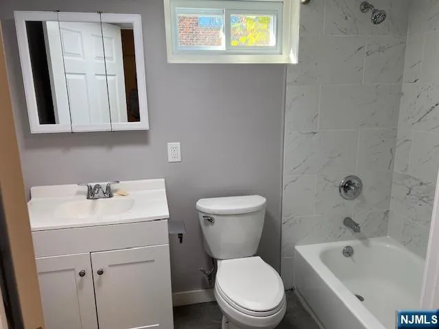 a view of an empty room and wooden floor