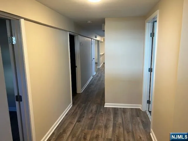 a kitchen with granite countertop cabinets stainless steel appliances and sink