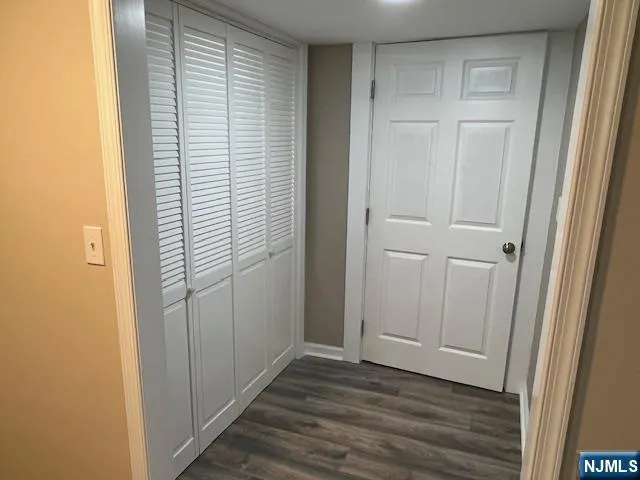 an empty room with wooden floor