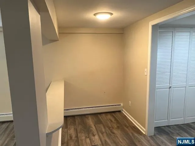 a kitchen with a sink a refrigerator and a stove top oven