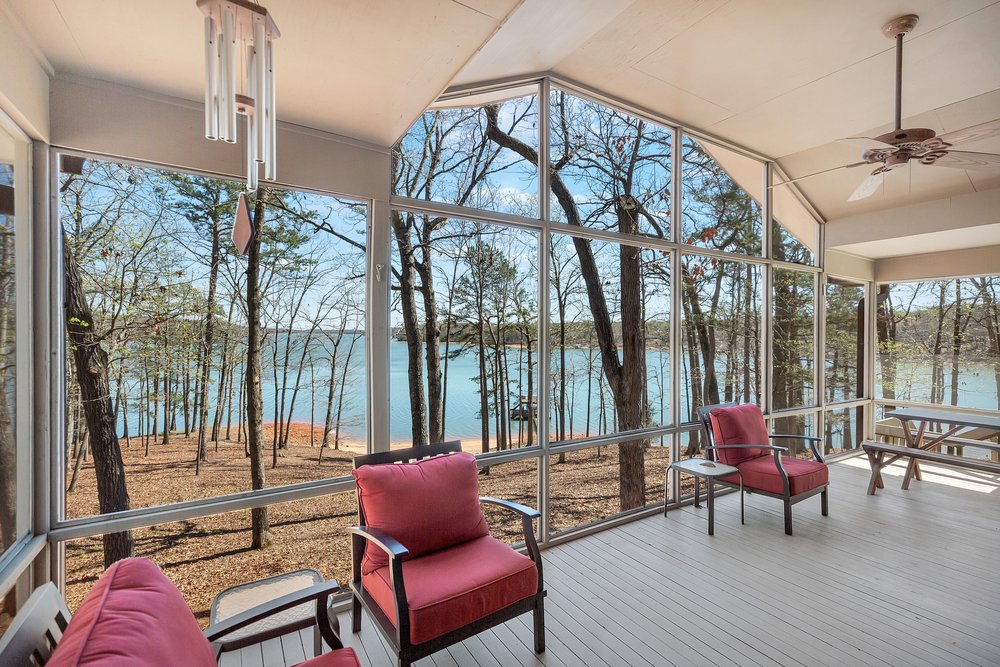 738 Seminole Point Road Fair Play, SC 29643 - Photo 18 of 46 This screened porch offers serene lake views, perfect for relaxation.
