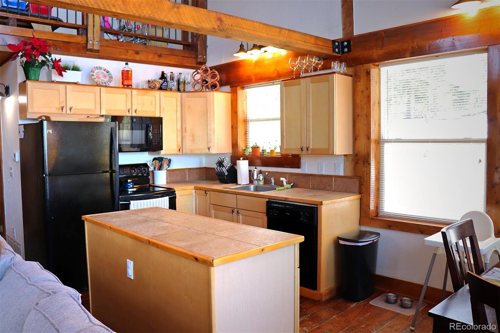 947 Bellows Road Hartsel, CO 80449 - Photo 8 of 34 a kitchen that has a sink a stove and a refrigerator