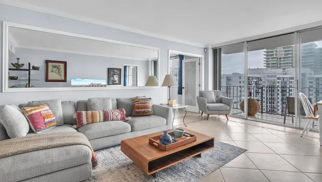 a bedroom with a bed and glass door