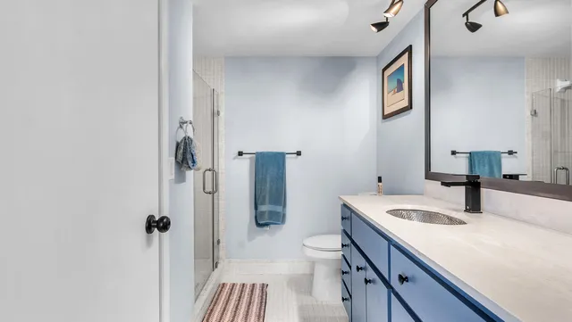 a bathroom with a sink double vanity window and a bathtub