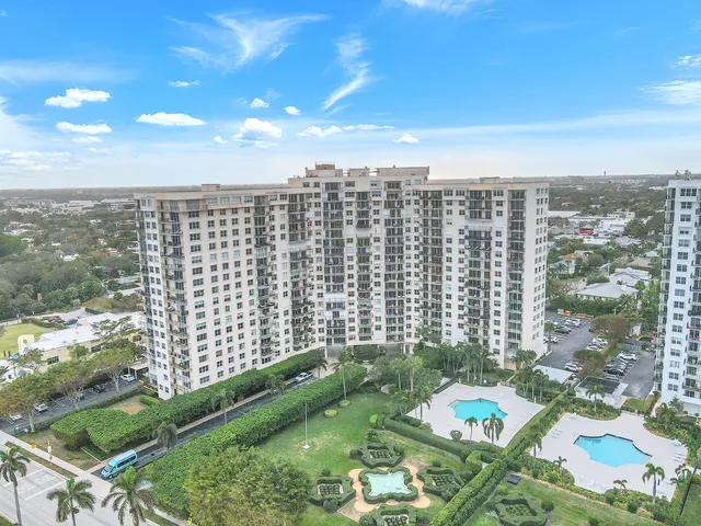 a living room with fireplace furniture and a wooden floor