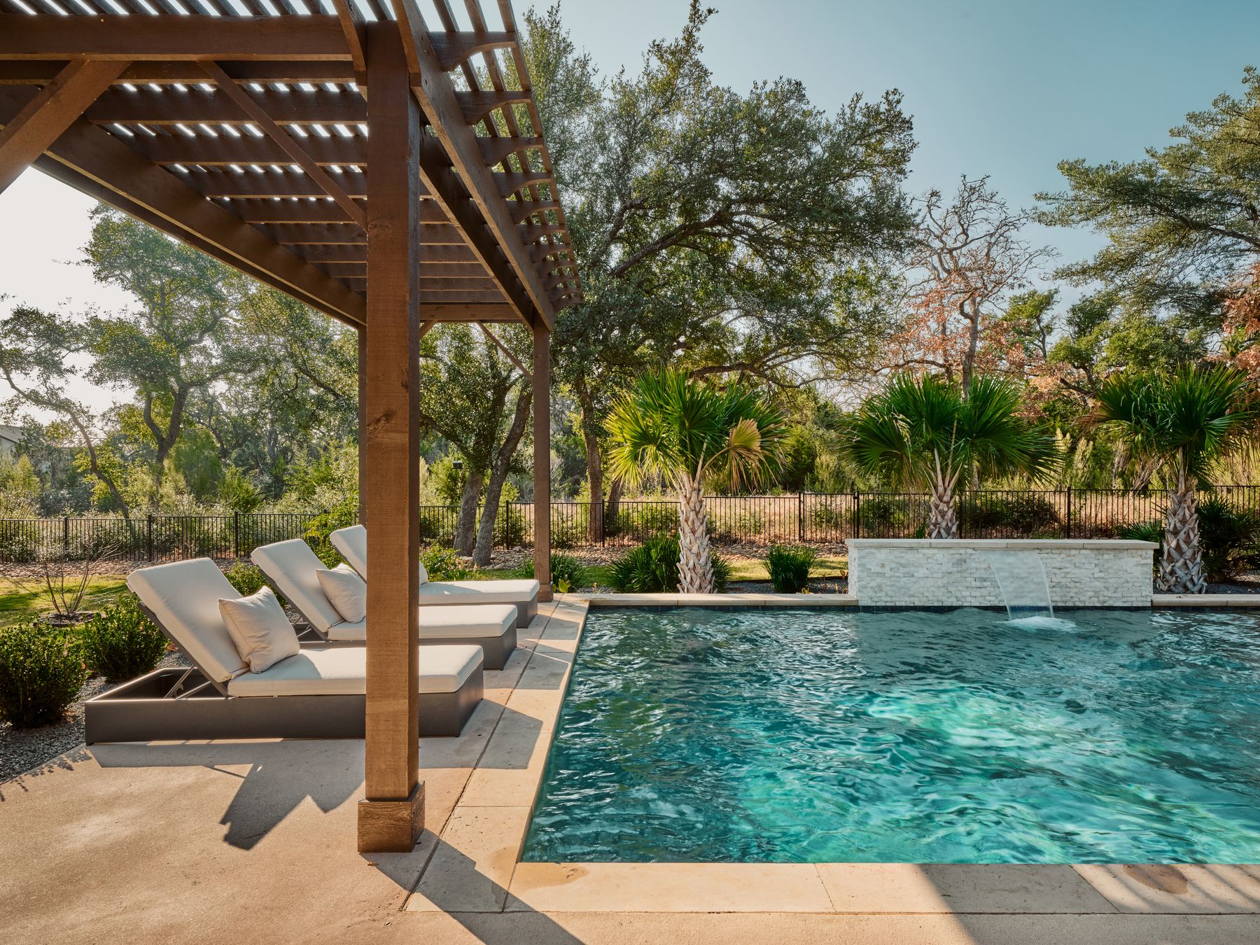 183 Tiffanie Way Austin, TX 78737 - Photo 32 of 37 View of pool with patio surround, a fenced backyard, and a pergola