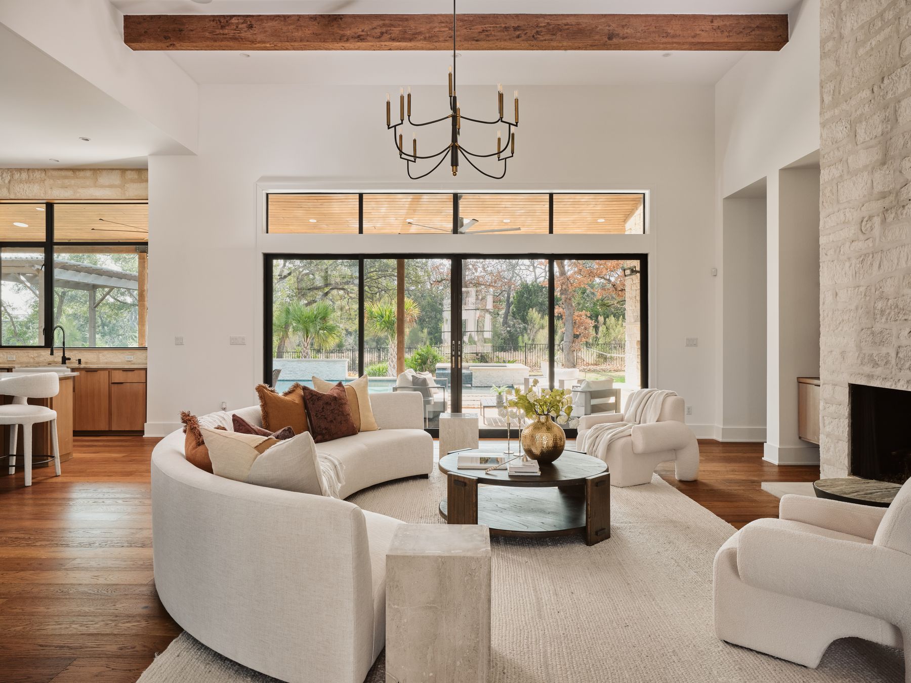 183 Tiffanie Way Austin, TX 78737 - Photo 5 of 37 Living area featuring dark wood-style flooring, a chandelier, and a fireplace
