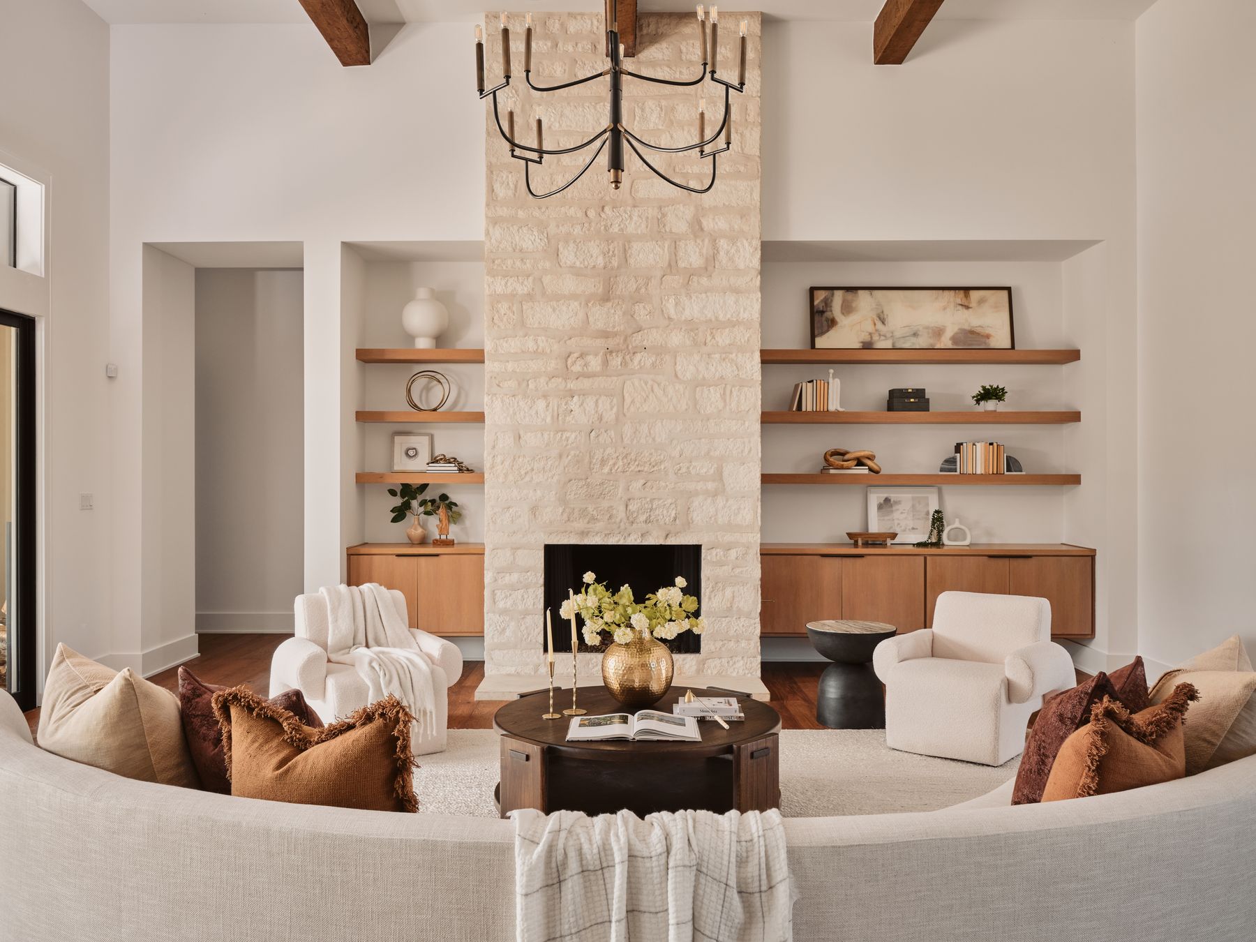 183 Tiffanie Way Austin, TX 78737 - Photo 6 of 37 Living room featuring a fireplace, built in features, wood finished floors, and hanging lights