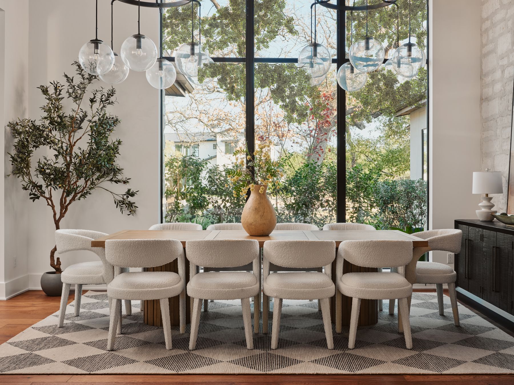 183 Tiffanie Way Austin, TX 78737 - Photo 7 of 37 Dining space with light wood-style flooring and expansive windows