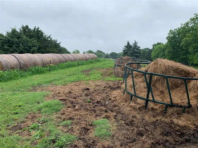 a view of backyard with seating area and green space