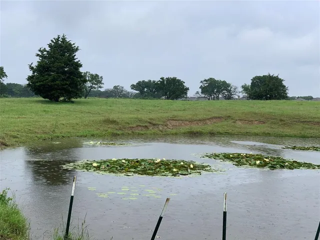 a view of a lake with a big yard