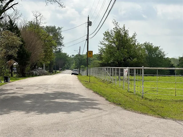 a view of a swimming pool with a yard