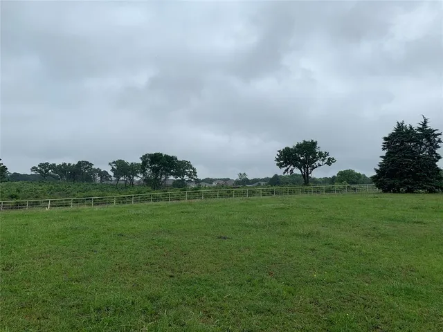 a view of a golf course with a lake