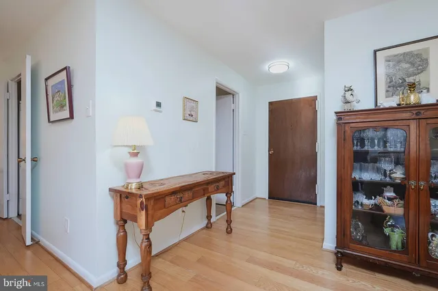 a view of room with furniture and wooden floor
