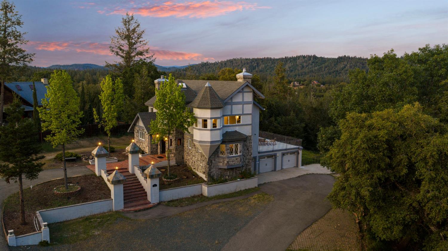 a view of a house with a yard from a terrace