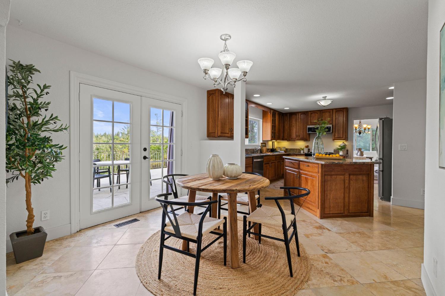 22160 Winchester Way Colfax, CA 95713 - Photo 20 of 84 a view of a dining room with furniture and chandelier