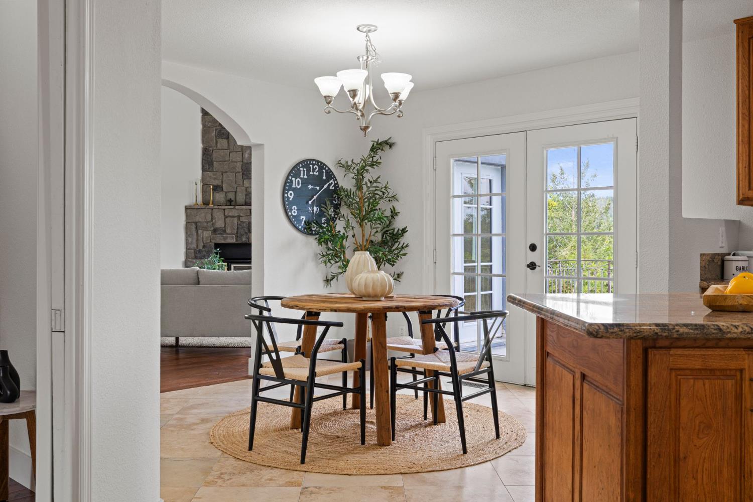 22160 Winchester Way Colfax, CA 95713 - Photo 21 of 84 a dining room filled chandelier and wooden floor