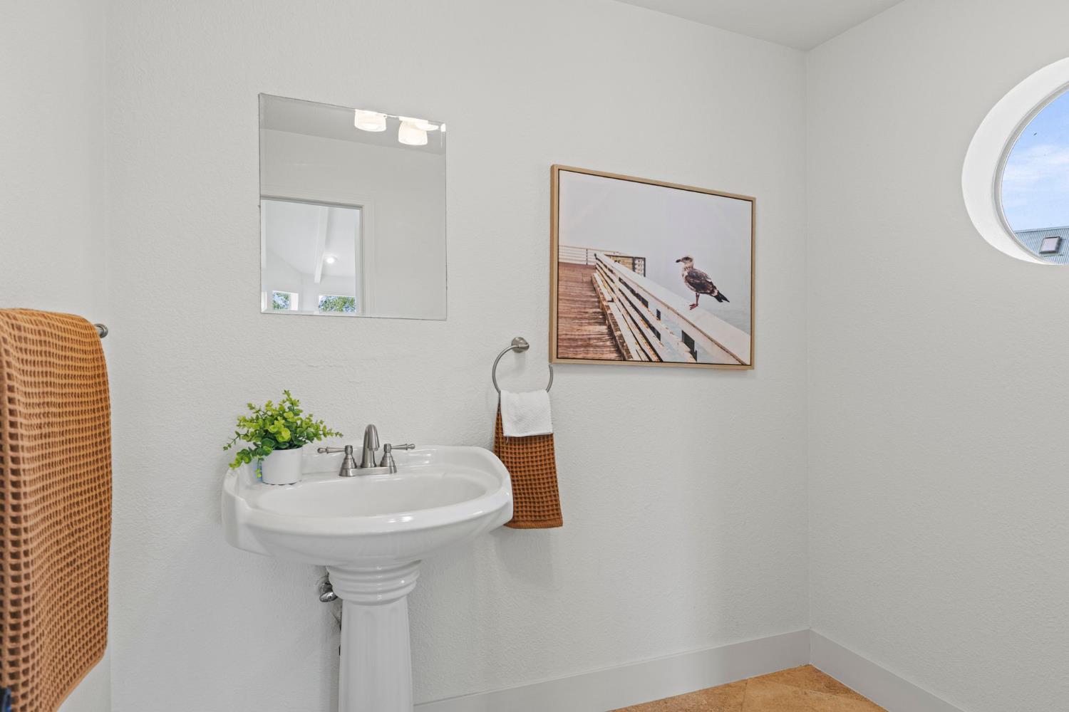 22160 Winchester Way Colfax, CA 95713 - Photo 39 of 84 a bathroom with a sink and a mirror