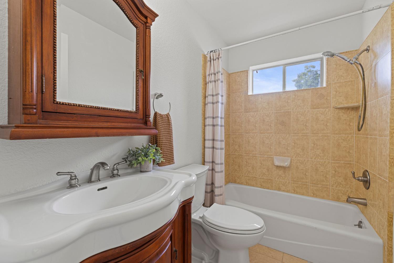 22160 Winchester Way Colfax, CA 95713 - Photo 42 of 84 a bathroom with a sink a toilet and shower