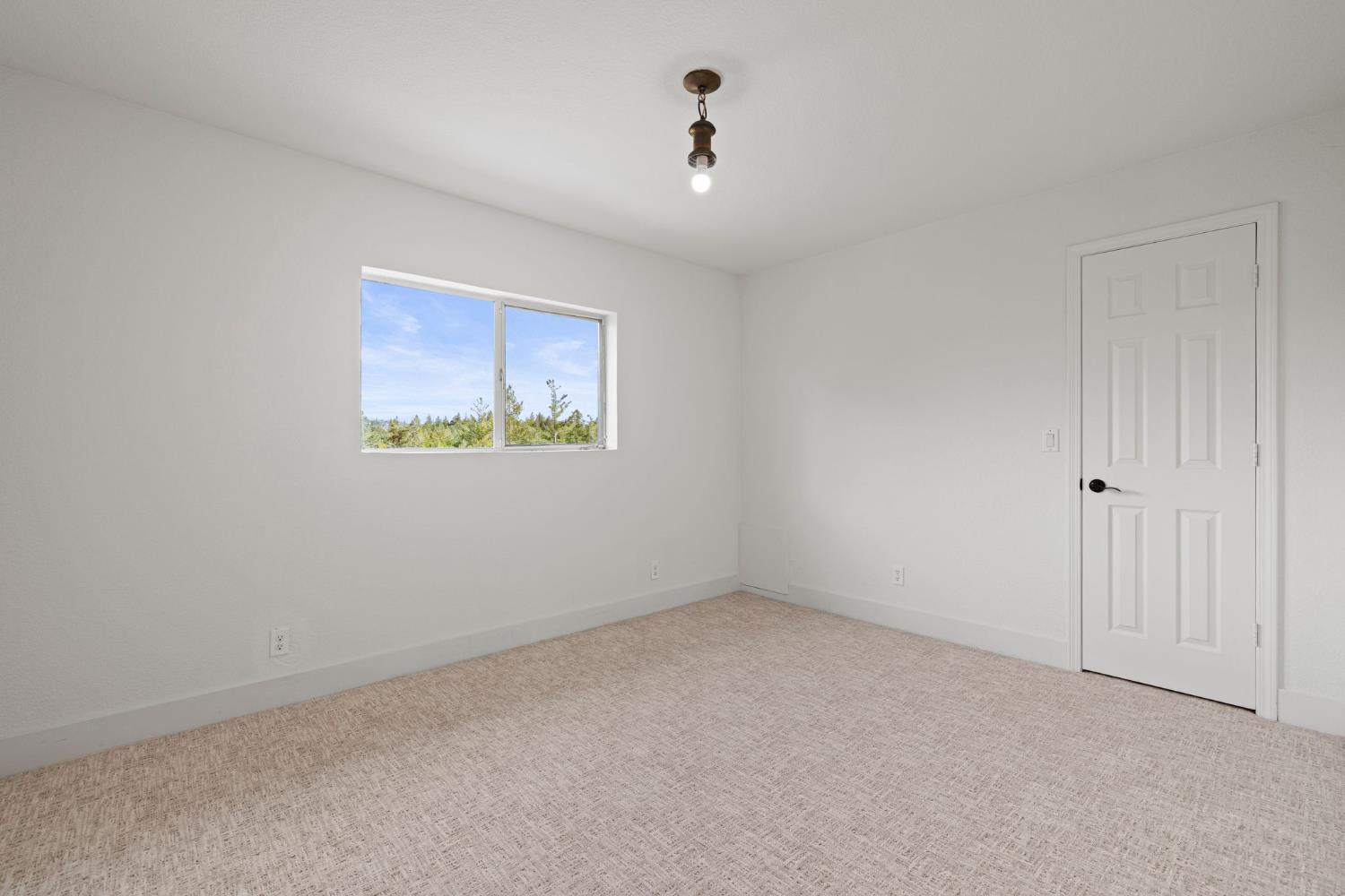22160 Winchester Way Colfax, CA 95713 - Photo 45 of 84 a view of an empty room with a window