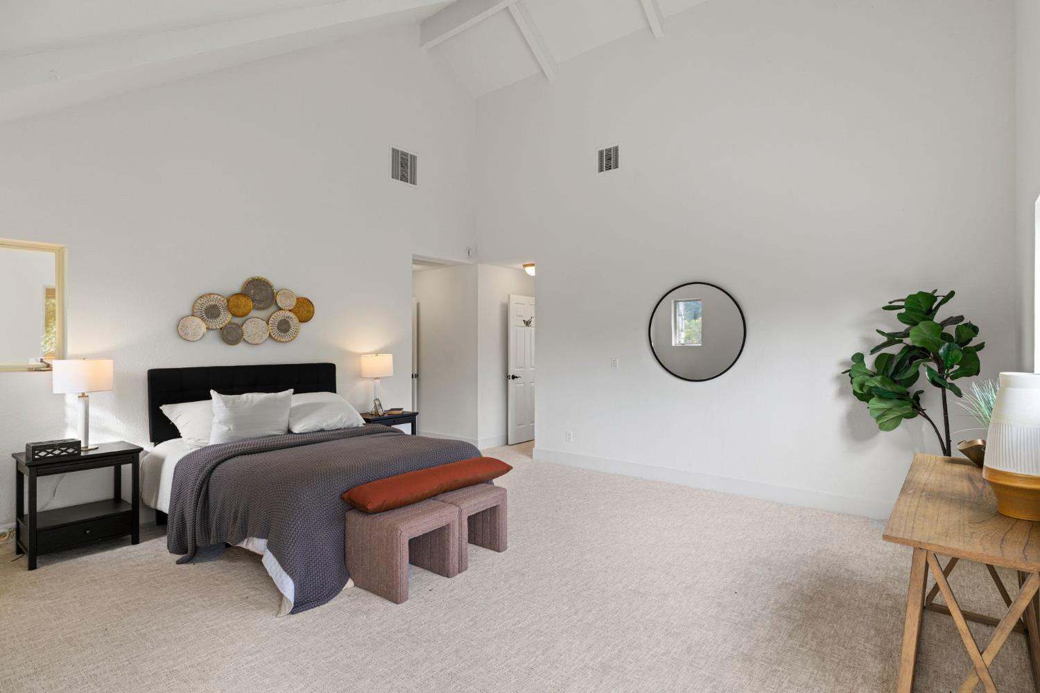 22160 Winchester Way Colfax, CA 95713 - Photo 51 of 84 a bedroom with bed and a potted plant