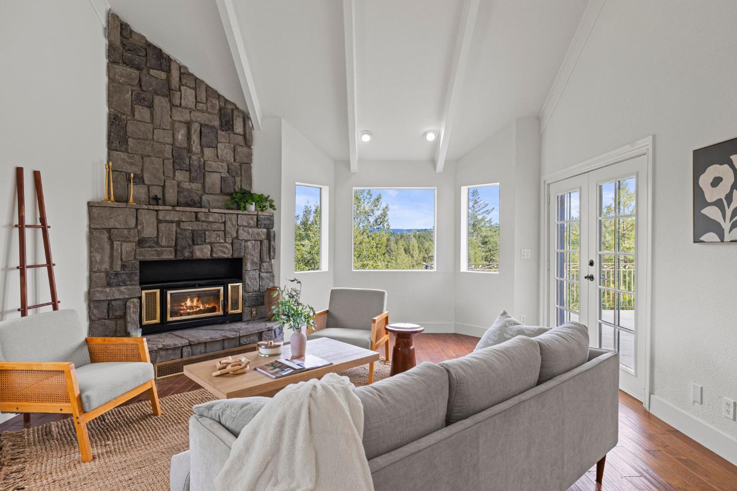 22160 Winchester Way Colfax, CA 95713 - Photo 6 of 84 a living room with furniture a fireplace and a large window