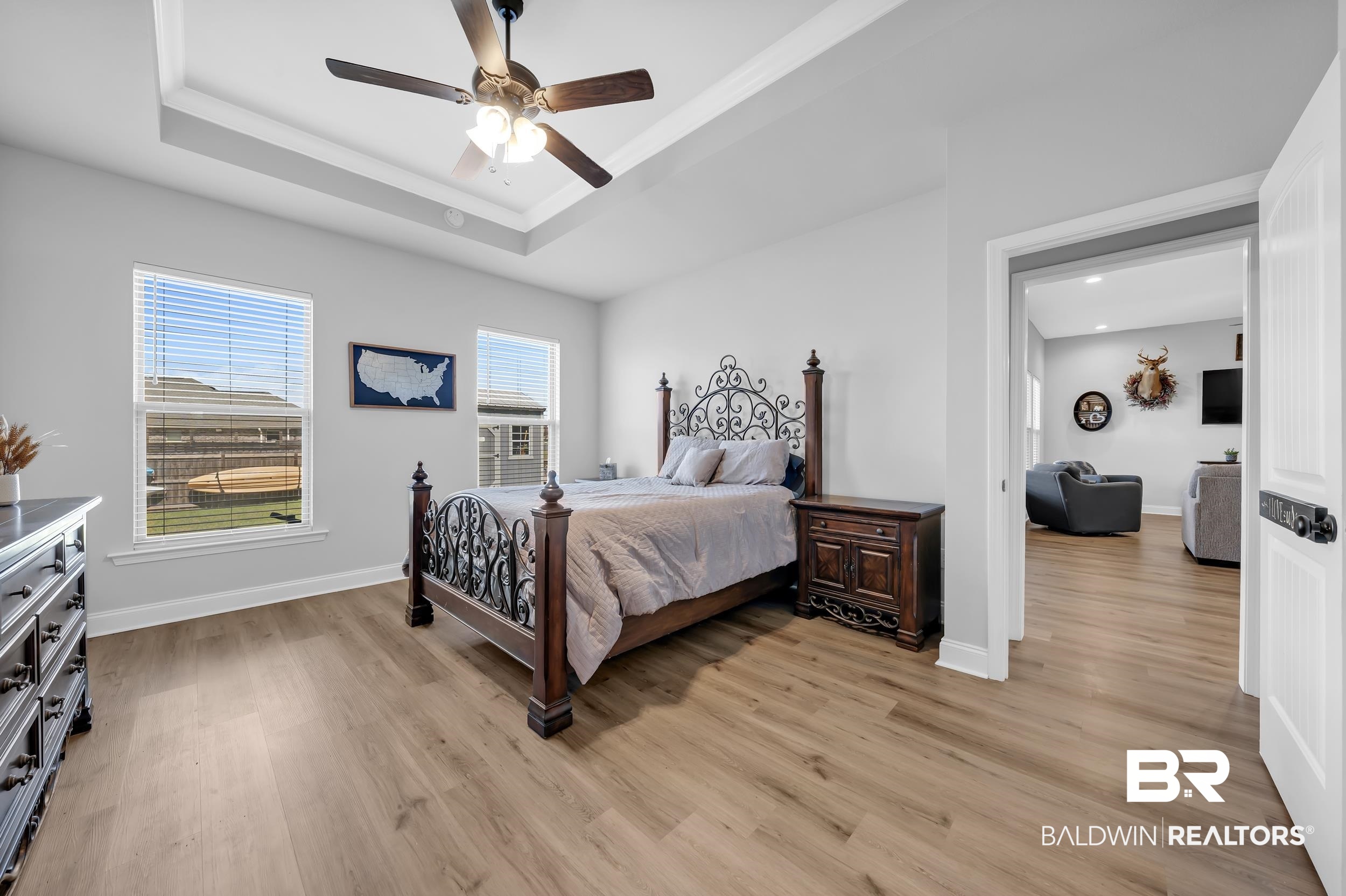 1176 Stella Road Foley, AL 36535 - Photo 16 of 40 Bedroom with light wood-type flooring, ceiling fan, and crown molding