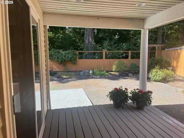 a view of backyard with hardwood floor and outdoor seating