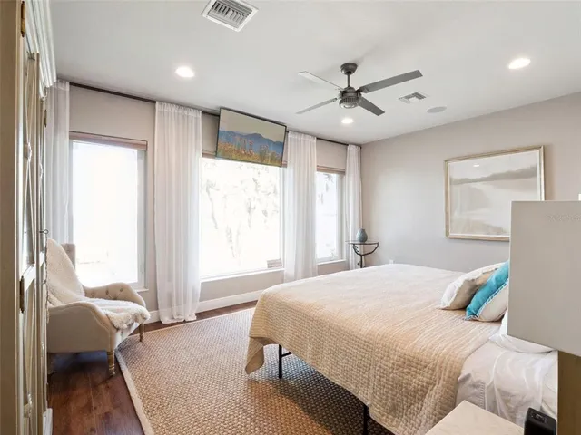 a bedroom with bed and a window