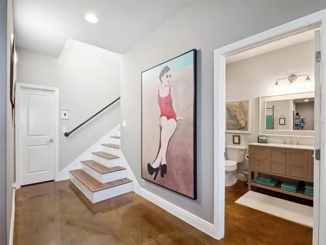 a living room with furniture a couch and a dresser