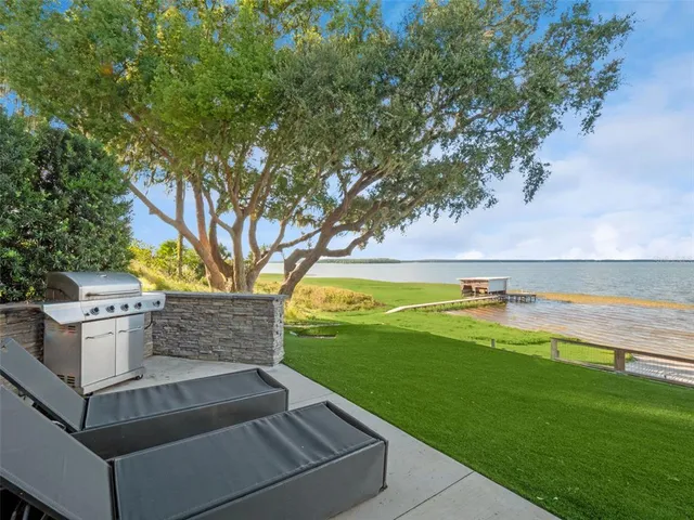 an aerial view of house with yard swimming pool and outdoor seating