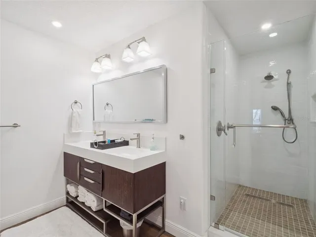 an aerial view of house with yard swimming pool and outdoor seating