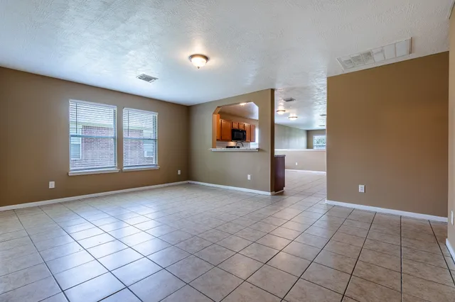 a view of a livingroom with a kitchen
