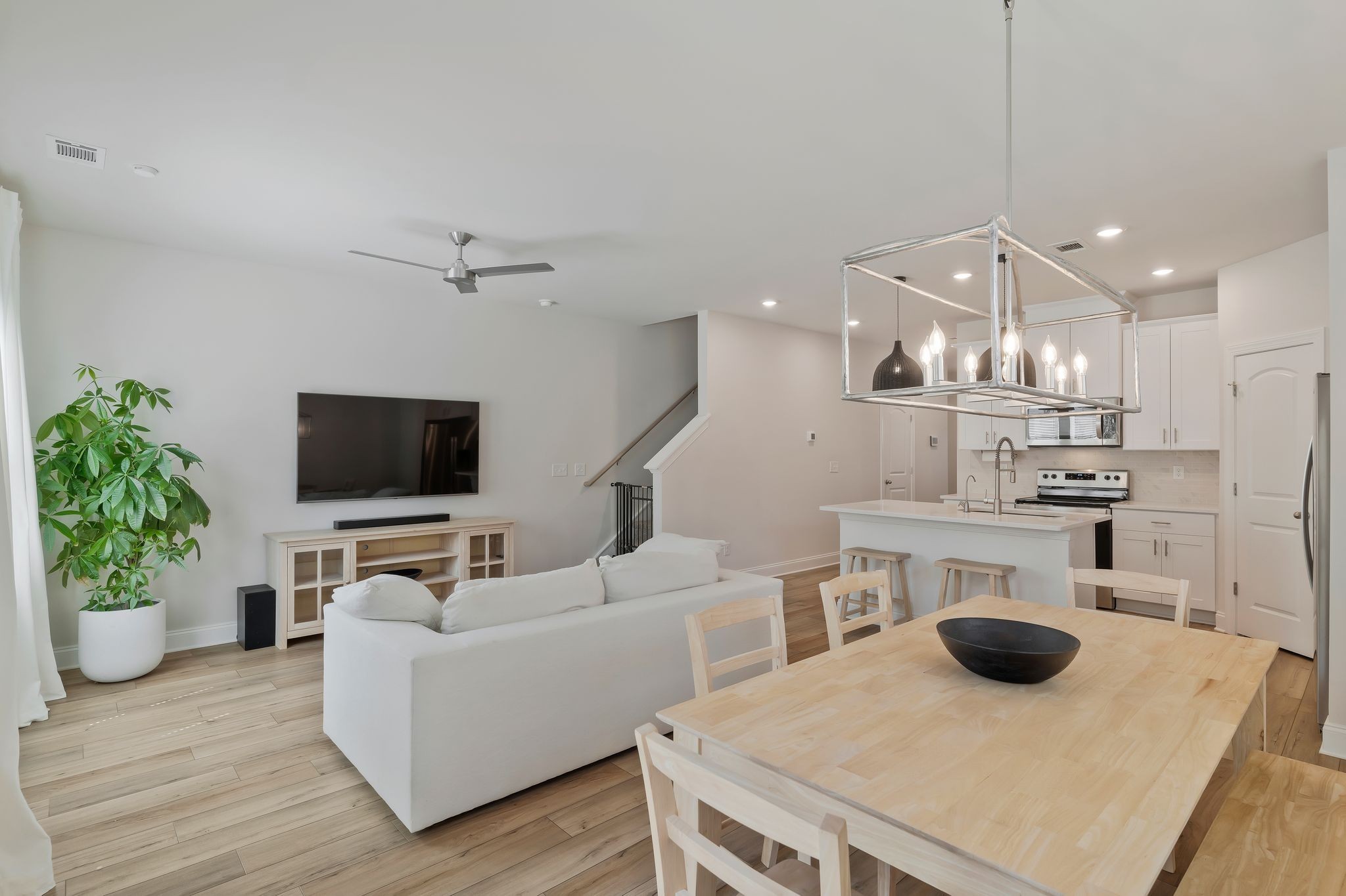 4669 Ridge Bend Drive Nashville, TN 37207 - Photo 12 of 33 a living room with furniture a flat screen tv and kitchen view