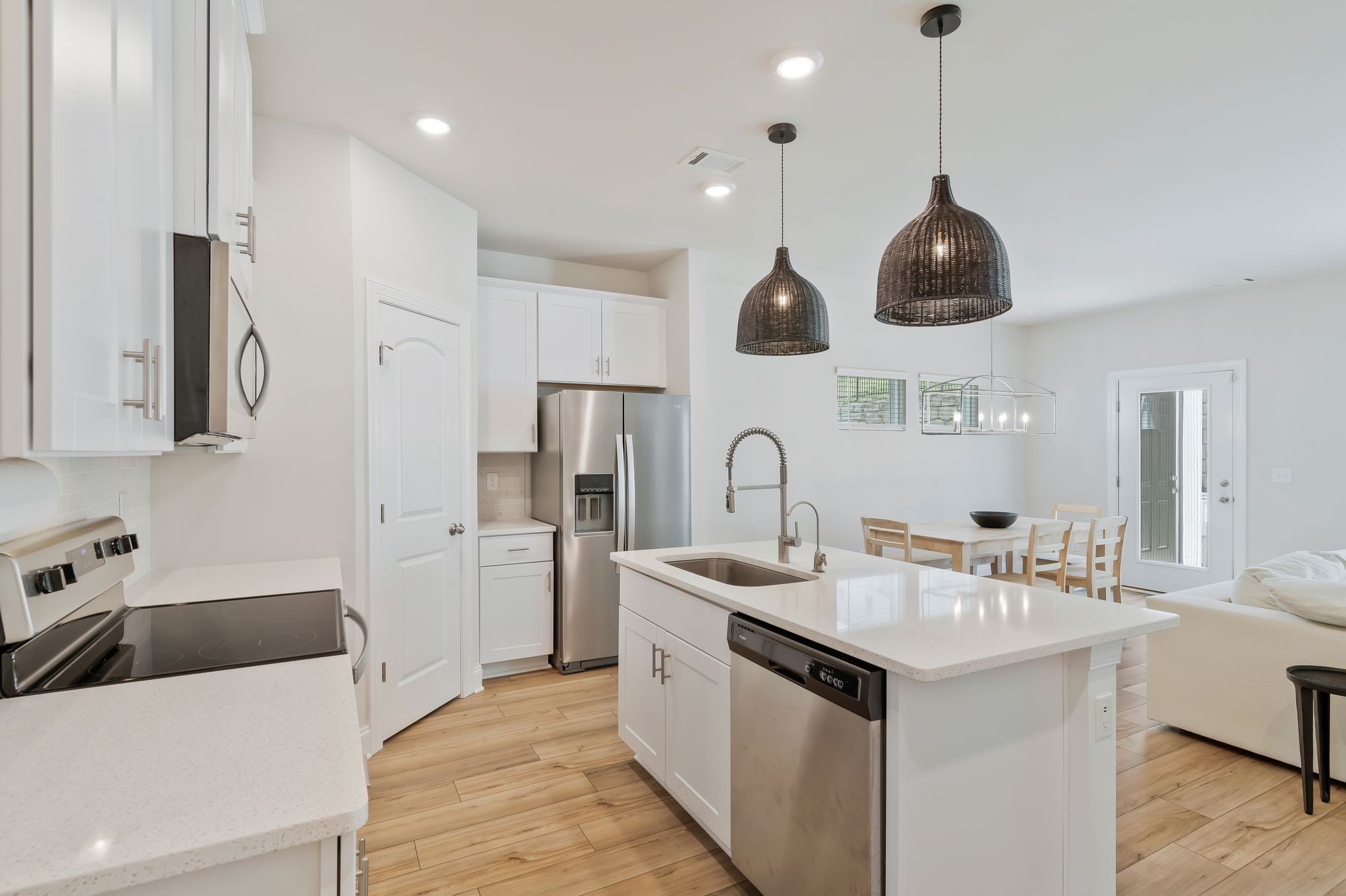 4669 Ridge Bend Drive Nashville, TN 37207 - Photo 9 of 33 a kitchen with stainless steel appliances a sink a stove a refrigerator and cabinets