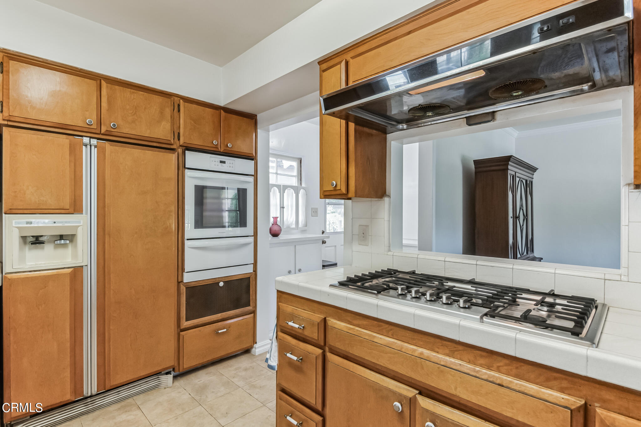 1827 West Mountain Street Glendale, CA 91201 - Photo 12 of 31 a kitchen with stainless steel appliances granite countertop a refrigerator and a stove