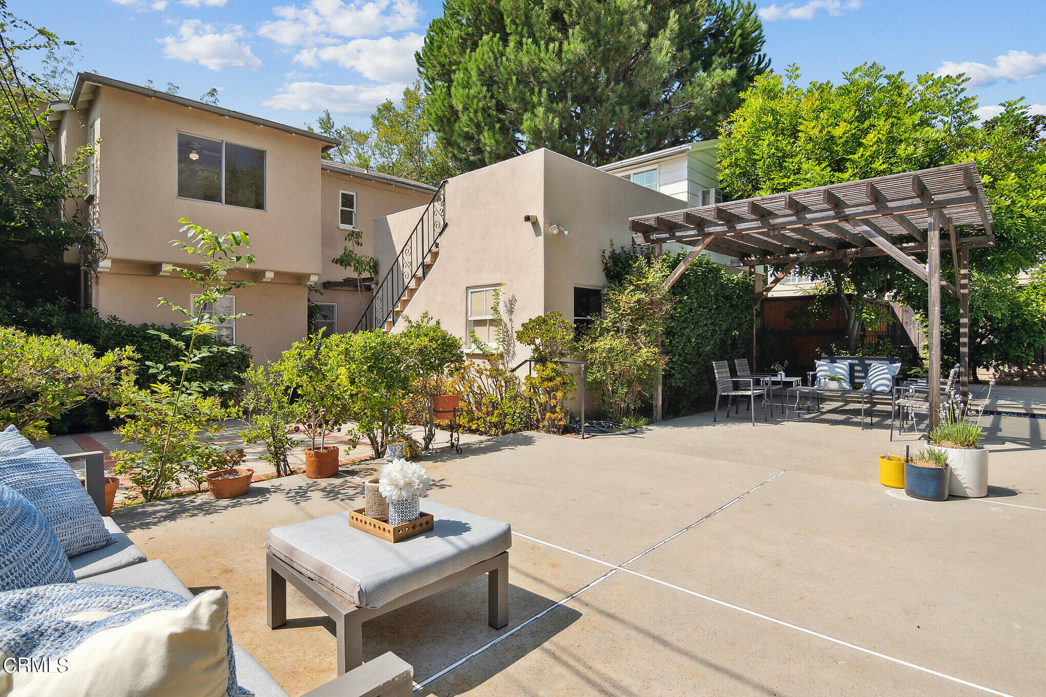 1827 West Mountain Street Glendale, CA 91201 - Photo 17 of 31 a view of a patio with couches table and chairs and potted plants