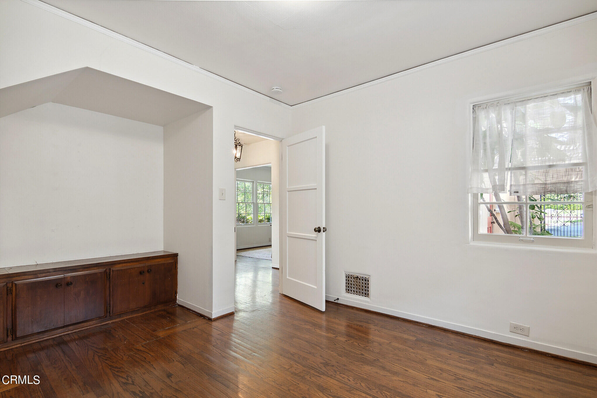 1827 West Mountain Street Glendale, CA 91201 - Photo 22 of 31 a view of an empty room with wooden floor and a window