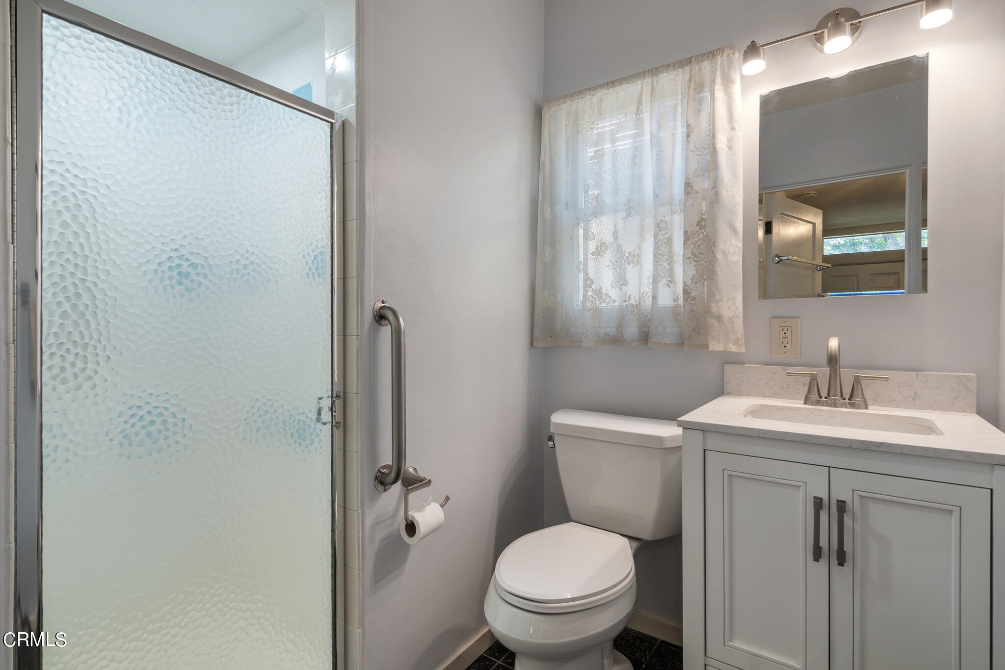 1827 West Mountain Street Glendale, CA 91201 - Photo 23 of 31 a bathroom with a toilet sink vanity and mirror