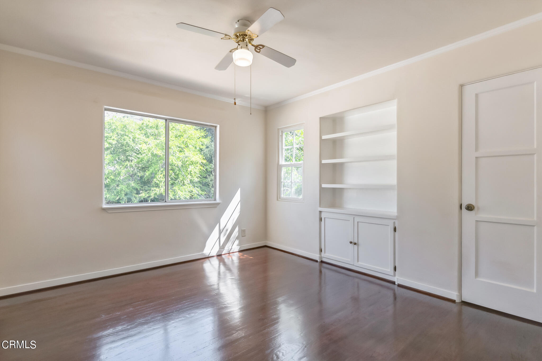 1827 West Mountain Street Glendale, CA 91201 - Photo 30 of 31 a view of an empty room with a window and wooden floor