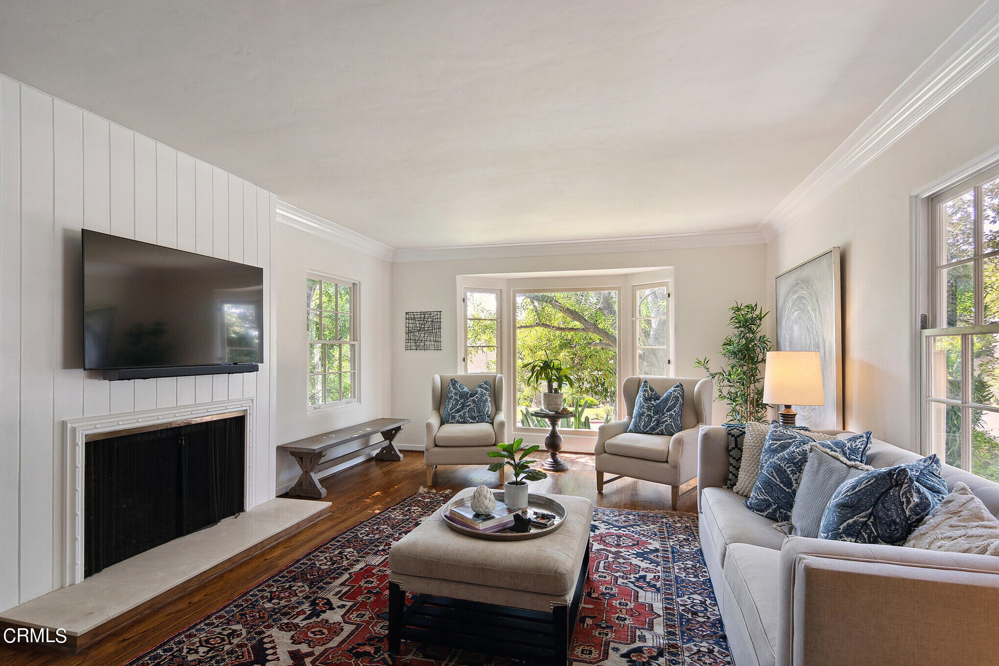 1827 West Mountain Street Glendale, CA 91201 - Photo 3 of 31 a living room with furniture a flat screen tv and a fireplace