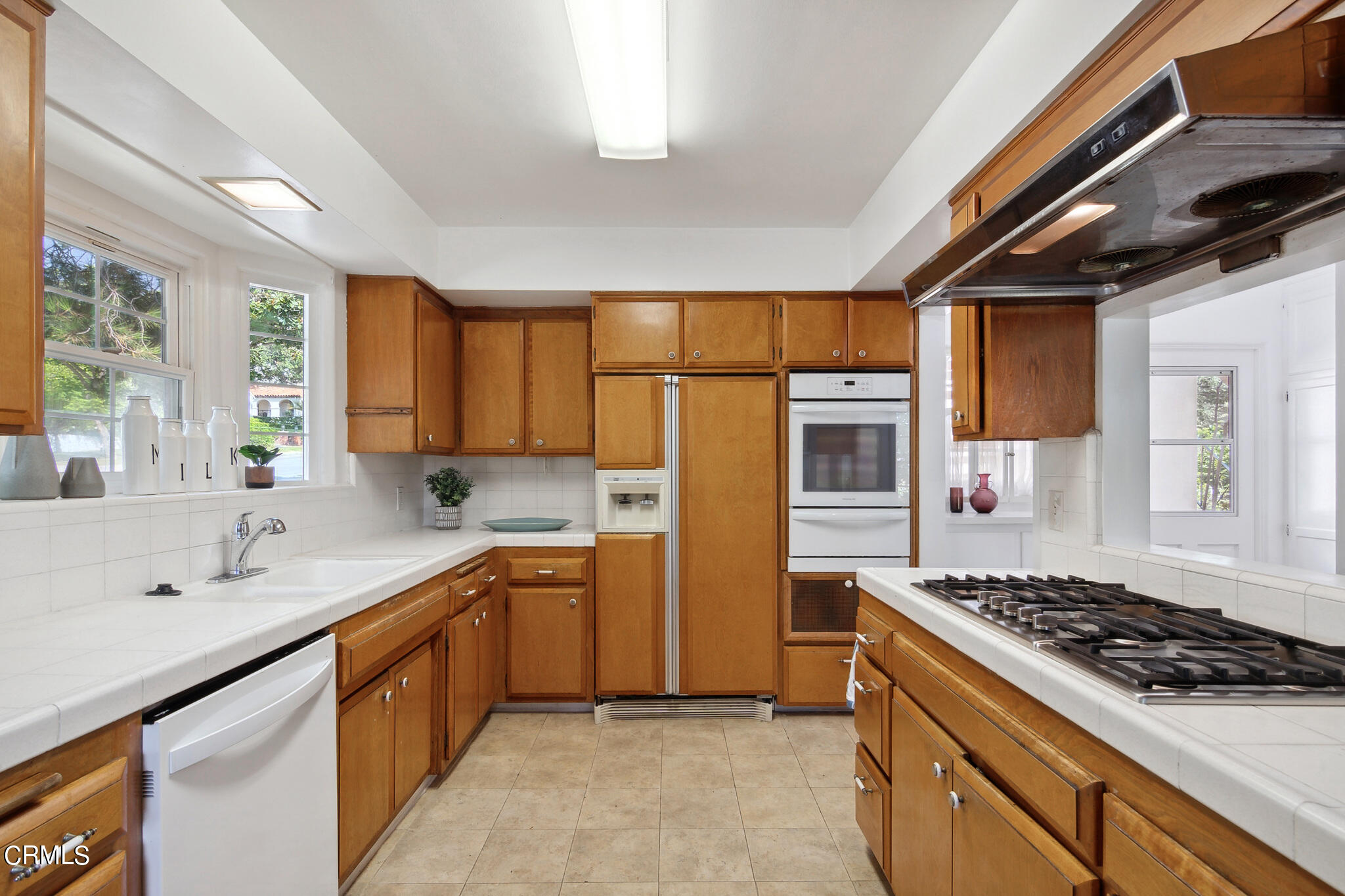 1827 West Mountain Street Glendale, CA 91201 - Photo 10 of 31 a kitchen with stainless steel appliances a sink stove and refrigerator