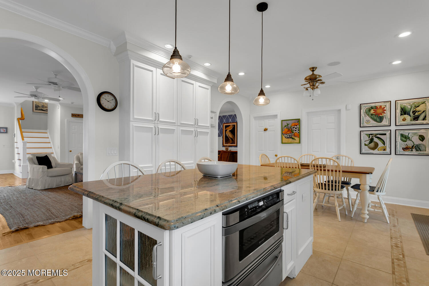 109 Salem Avenue Spring Lake, NJ 07762 - Photo 20 of 67 a kitchen with a stove a kitchen island a table and chairs