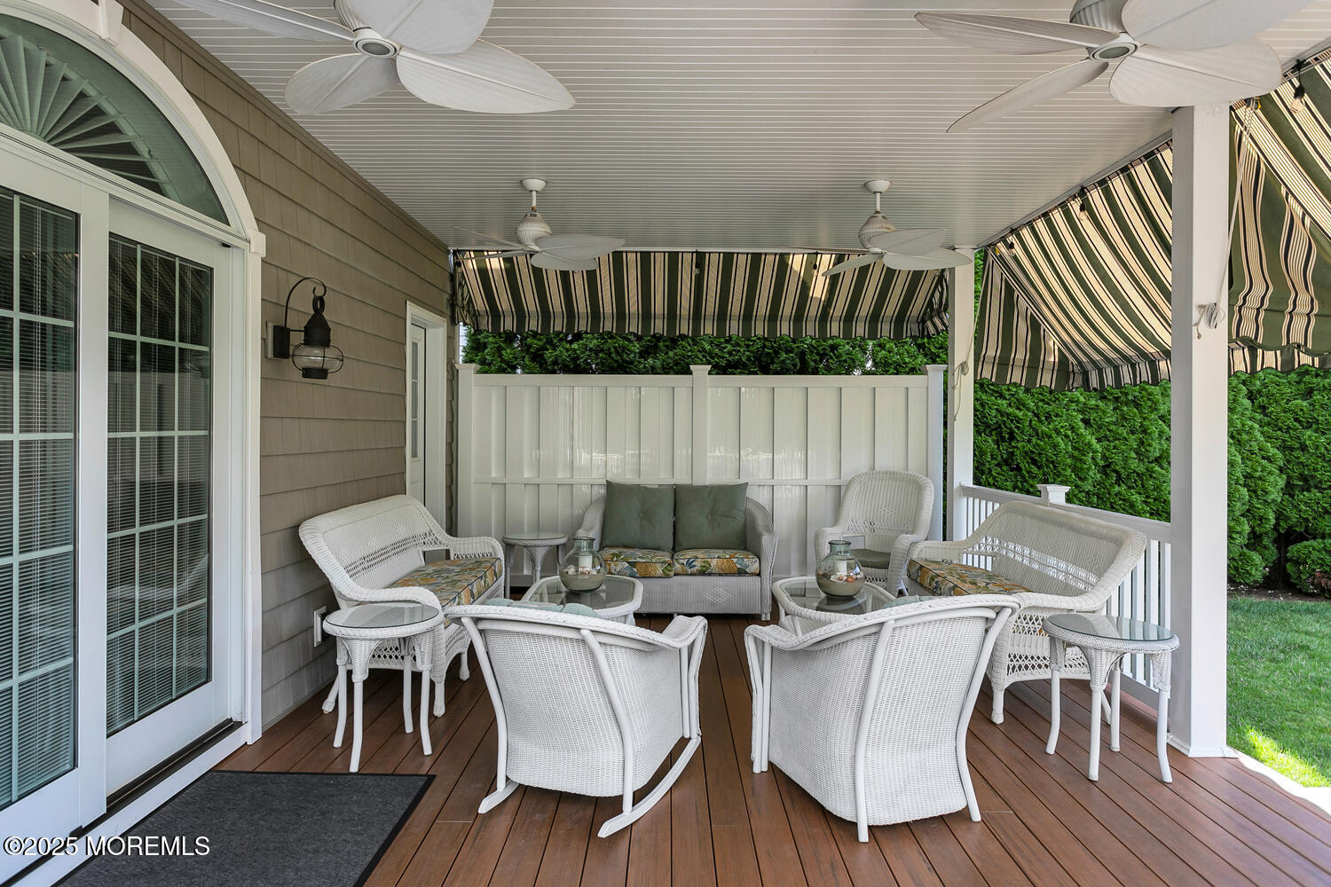 109 Salem Avenue Spring Lake, NJ 07762 - Photo 27 of 67 a view of a patio with table and chairs with wooden floor and fence