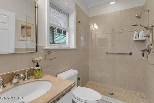 a bedroom with a bed window and a walk in closet