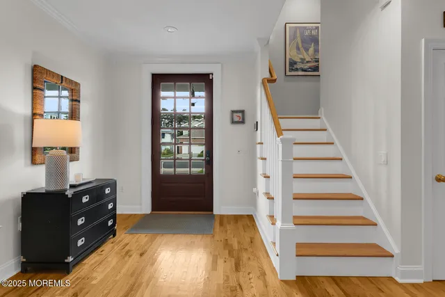 a bathroom with a granite countertop sink a shower a mirror and a shower