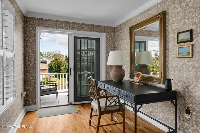 a spacious bathroom with a granite countertop sink a toilet and a mirror
