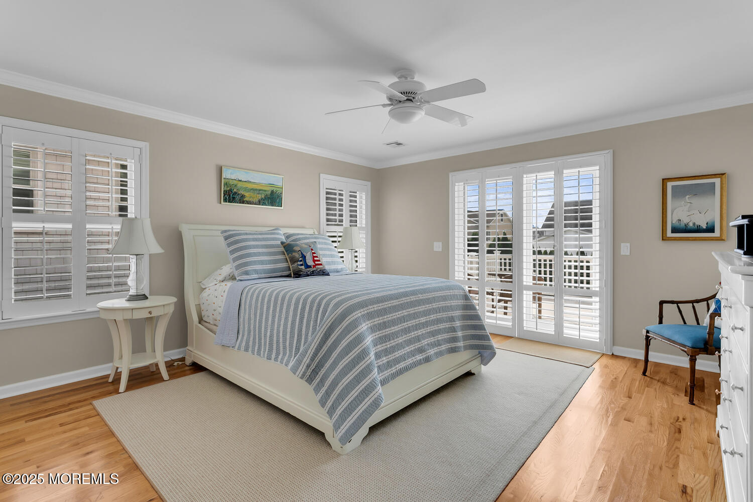 109 Salem Avenue Spring Lake, NJ 07762 - Photo 49 of 67 a spacious bedroom with a large bed and a chandelier