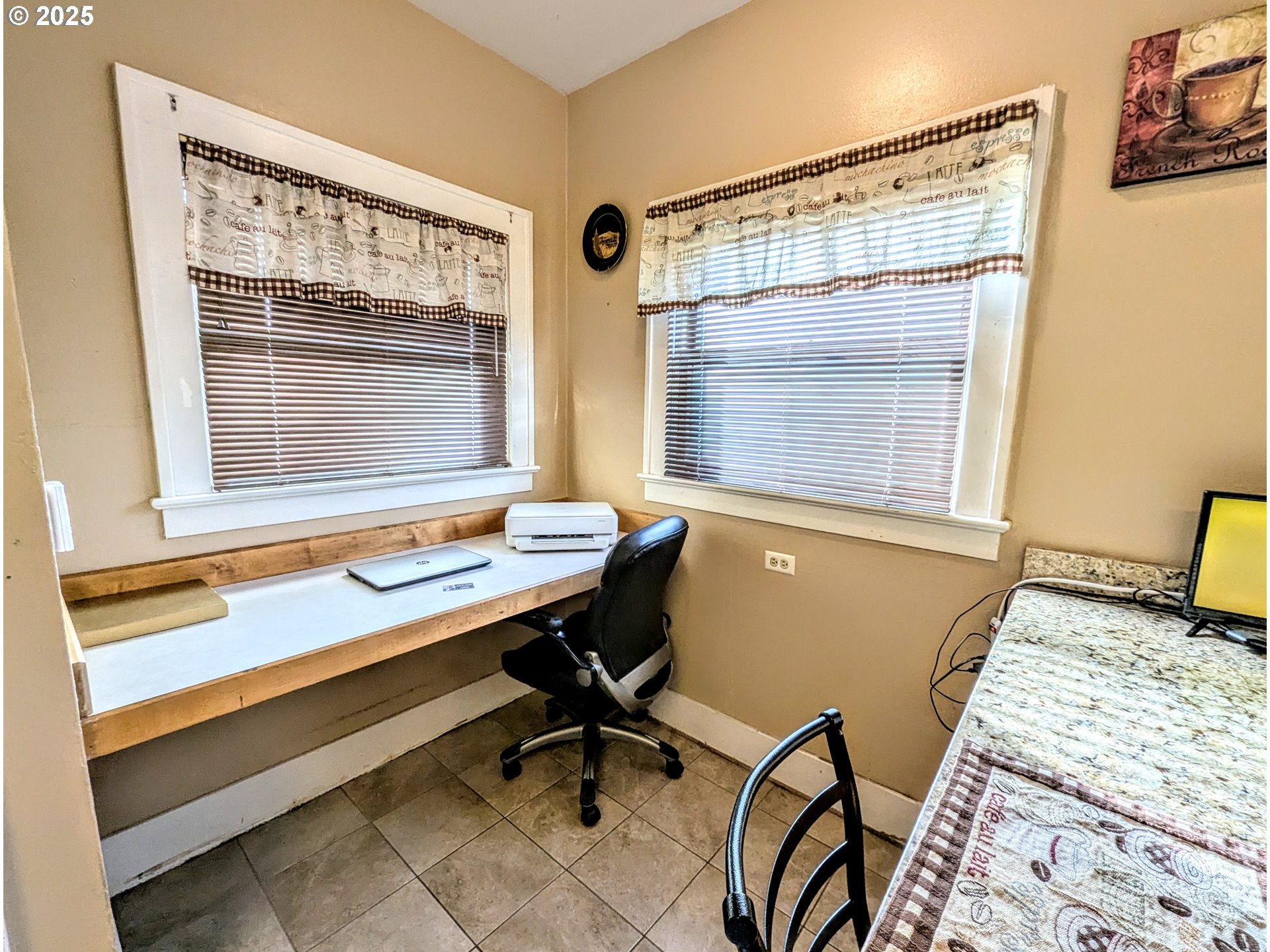 1302 9th Street La Grande, OR 97850 - Photo 11 of 15 a view of a workspace with furniture and a window